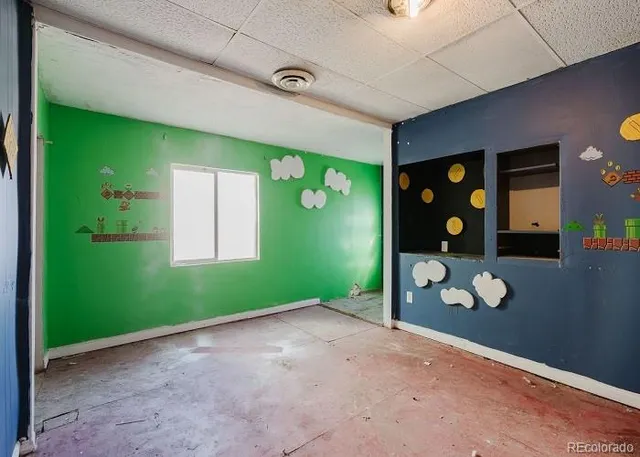 a view of storage and utility room with closet