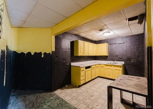 a kitchen with a stove and a refrigerator