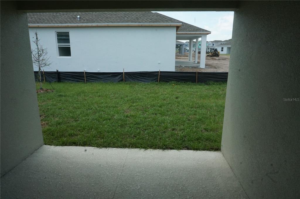 5704 Stephens Road St. Cloud, FL 34771 - Photo 12 of 12 a backyard of a house with barbeque oven