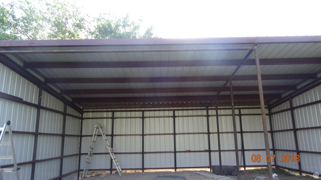 1040 West Mill Road Ferron, UT 84523 - Photo 110 of 117 Steel-framed structure featuring a corrugated metal roof and walls