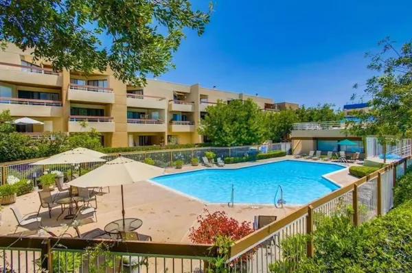 a view of a swimming pool with a patio