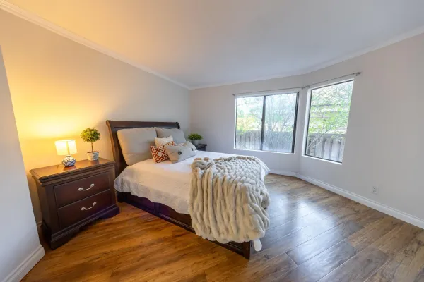 a bedroom with a bed and window