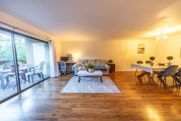 a living room with furniture and a table