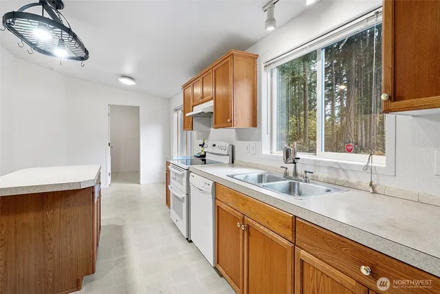 a kitchen with a sink and a window