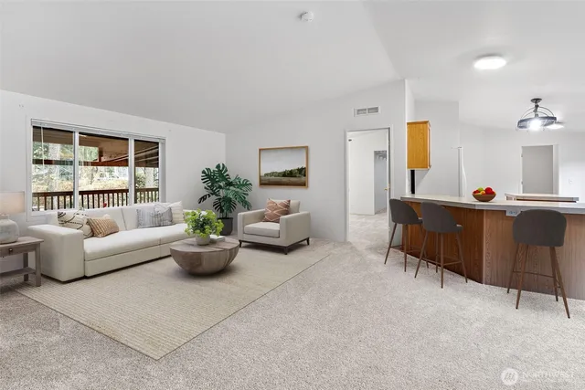 a living room with furniture and windows