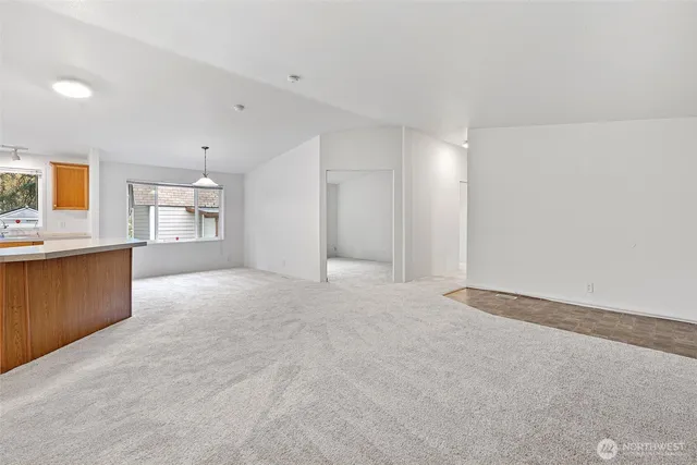 a view of a kitchen with a sink and cabinets