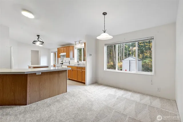 a view of a kitchen with furniture and window