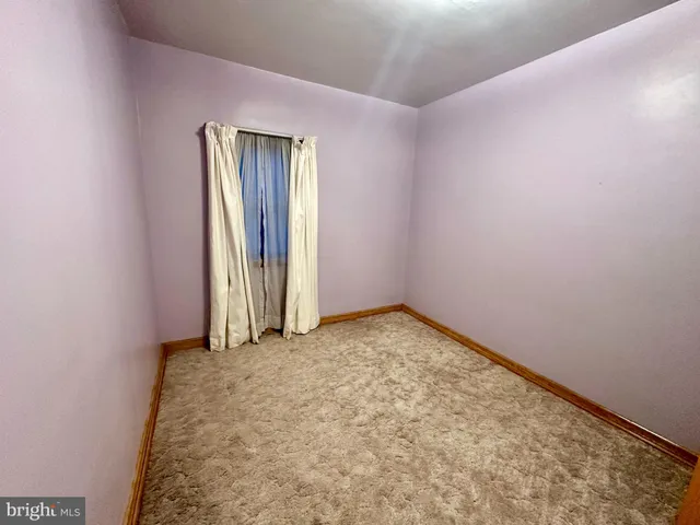 an empty room with a natural light