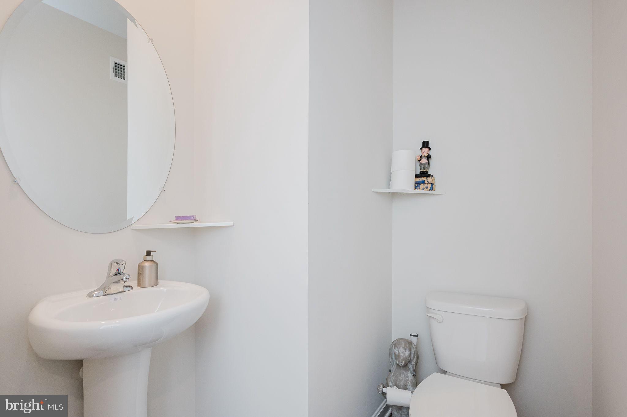 668 Beadlilly Way Joppa, MD 21085 - Photo 10 of 47 a bathroom with a sink a toilet and mirror