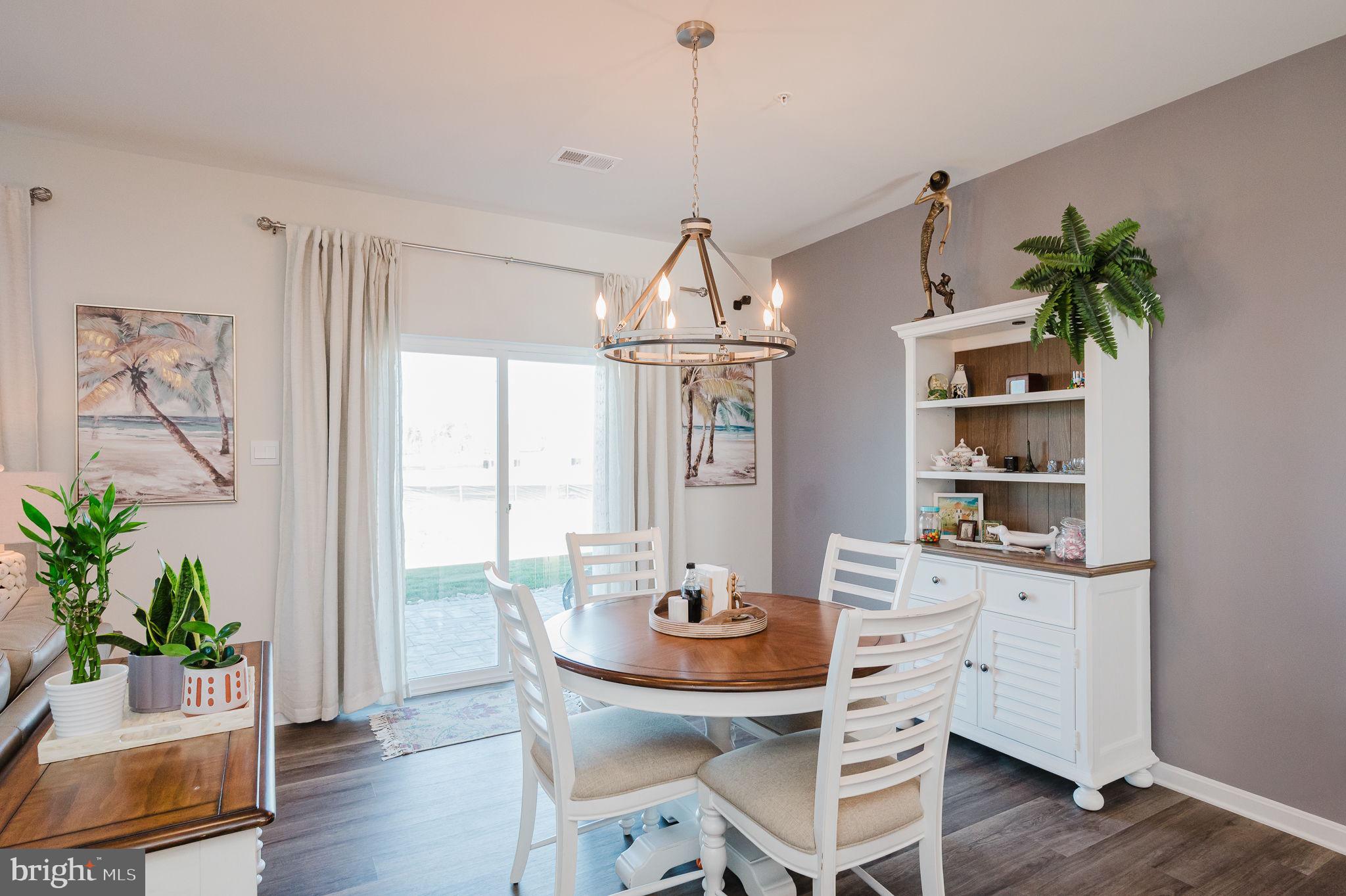 668 Beadlilly Way Joppa, MD 21085 - Photo 11 of 47 a dining room with furniture potted plants and wooden floor