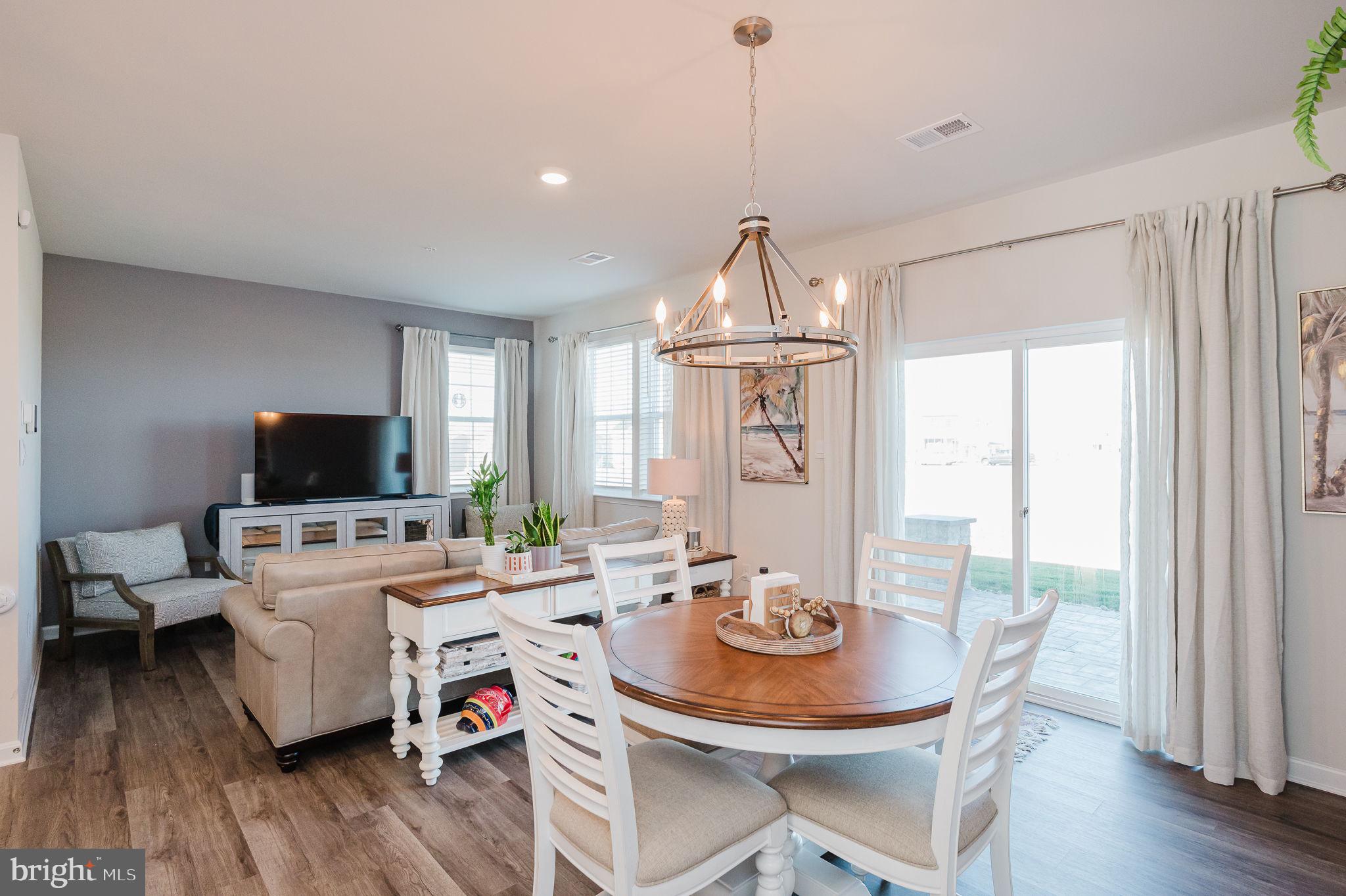 668 Beadlilly Way Joppa, MD 21085 - Photo 12 of 47 a view of a dining room with furniture window and wooden floor