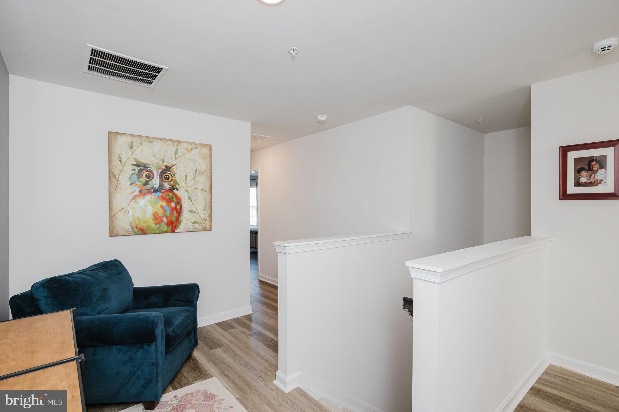 668 Beadlilly Way Joppa, MD 21085 - Photo 18 of 47 a living room with furniture and a white wall