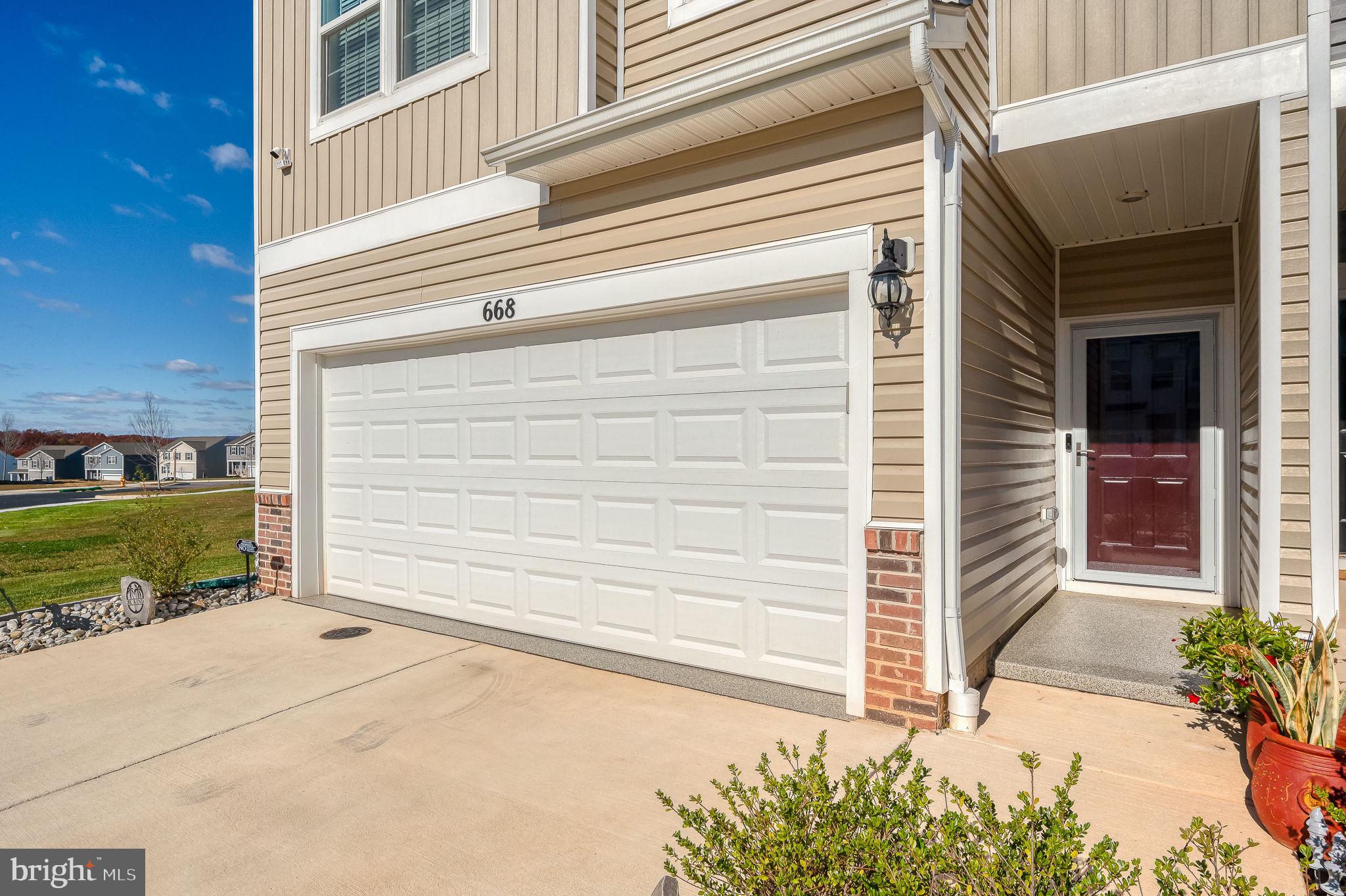 668 Beadlilly Way Joppa, MD 21085 - Photo 2 of 47 a view of a house with a small garden