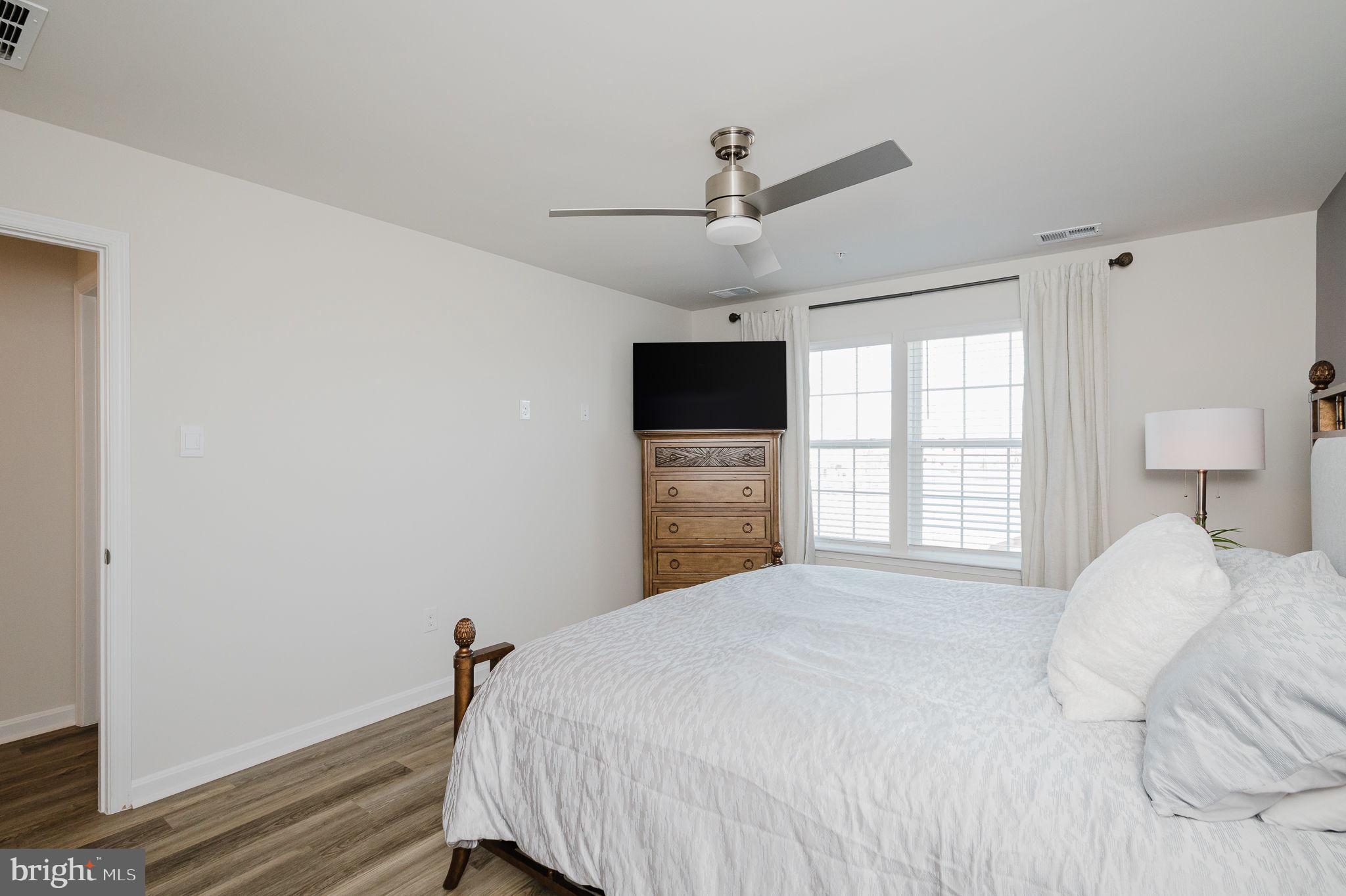 668 Beadlilly Way Joppa, MD 21085 - Photo 23 of 47 a bedroom with a large bed and a tv