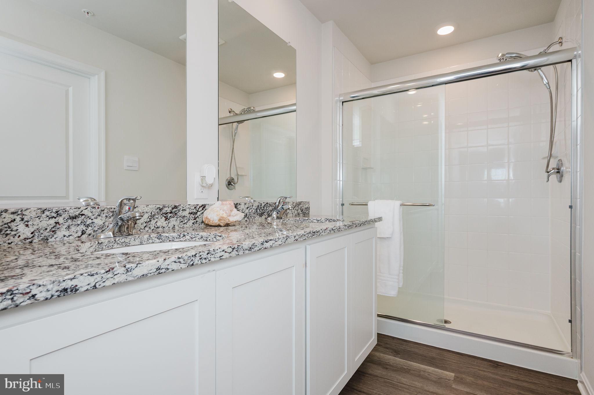 668 Beadlilly Way Joppa, MD 21085 - Photo 25 of 47 a bathroom with a granite countertop sink and a mirror