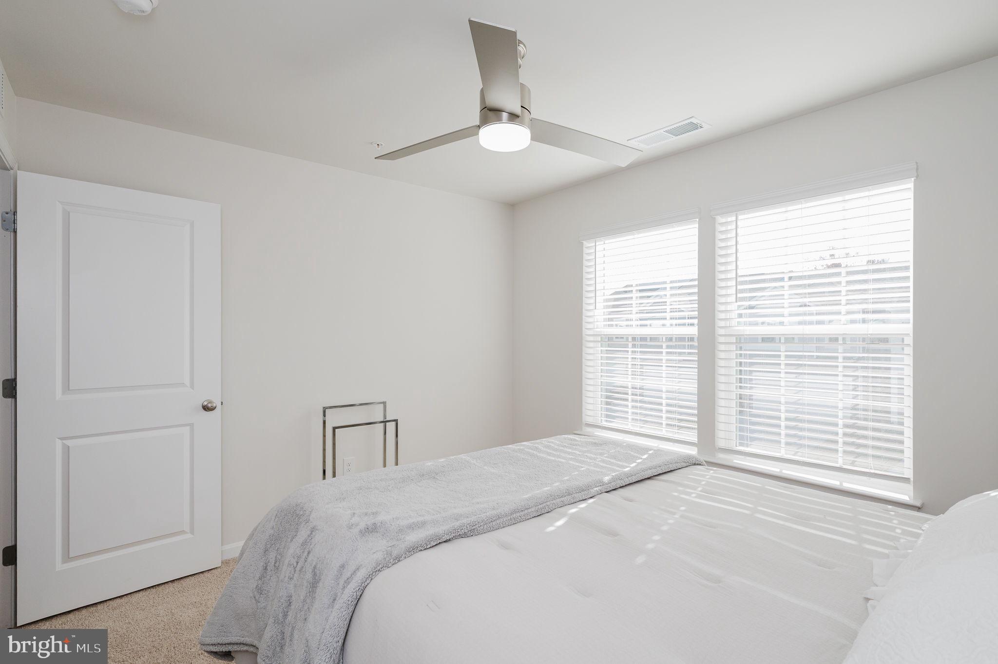 668 Beadlilly Way Joppa, MD 21085 - Photo 28 of 47 a bedroom with a bed and a large window