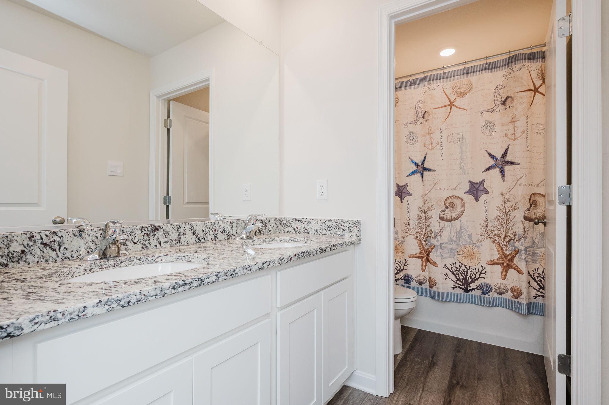668 Beadlilly Way Joppa, MD 21085 - Photo 30 of 47 a bathroom with a granite countertop sink and a mirror