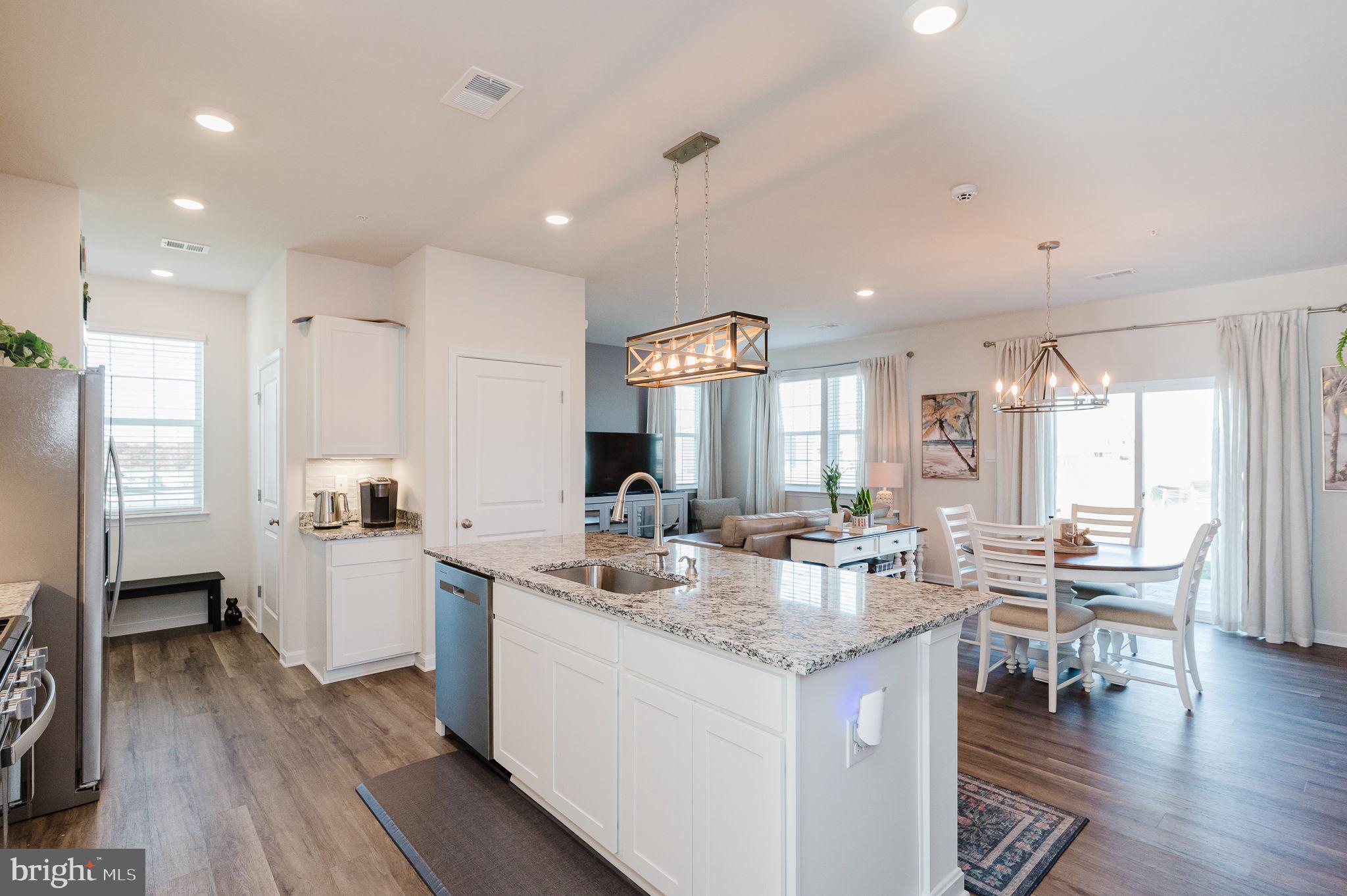 668 Beadlilly Way Joppa, MD 21085 - Photo 47 of 47 a large kitchen with a table and chairs in it