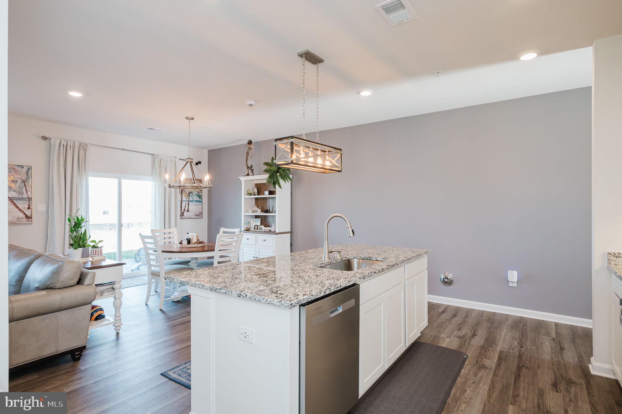 668 Beadlilly Way Joppa, MD 21085 - Photo 8 of 47 a view of a kitchen island wooden floor and living room