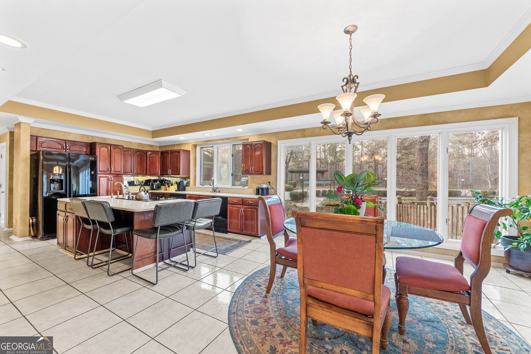140 Thorne Ridge Trail Fayetteville, GA 30214 - Photo 12 of 44 a dining room with furniture a chandelier and a rug