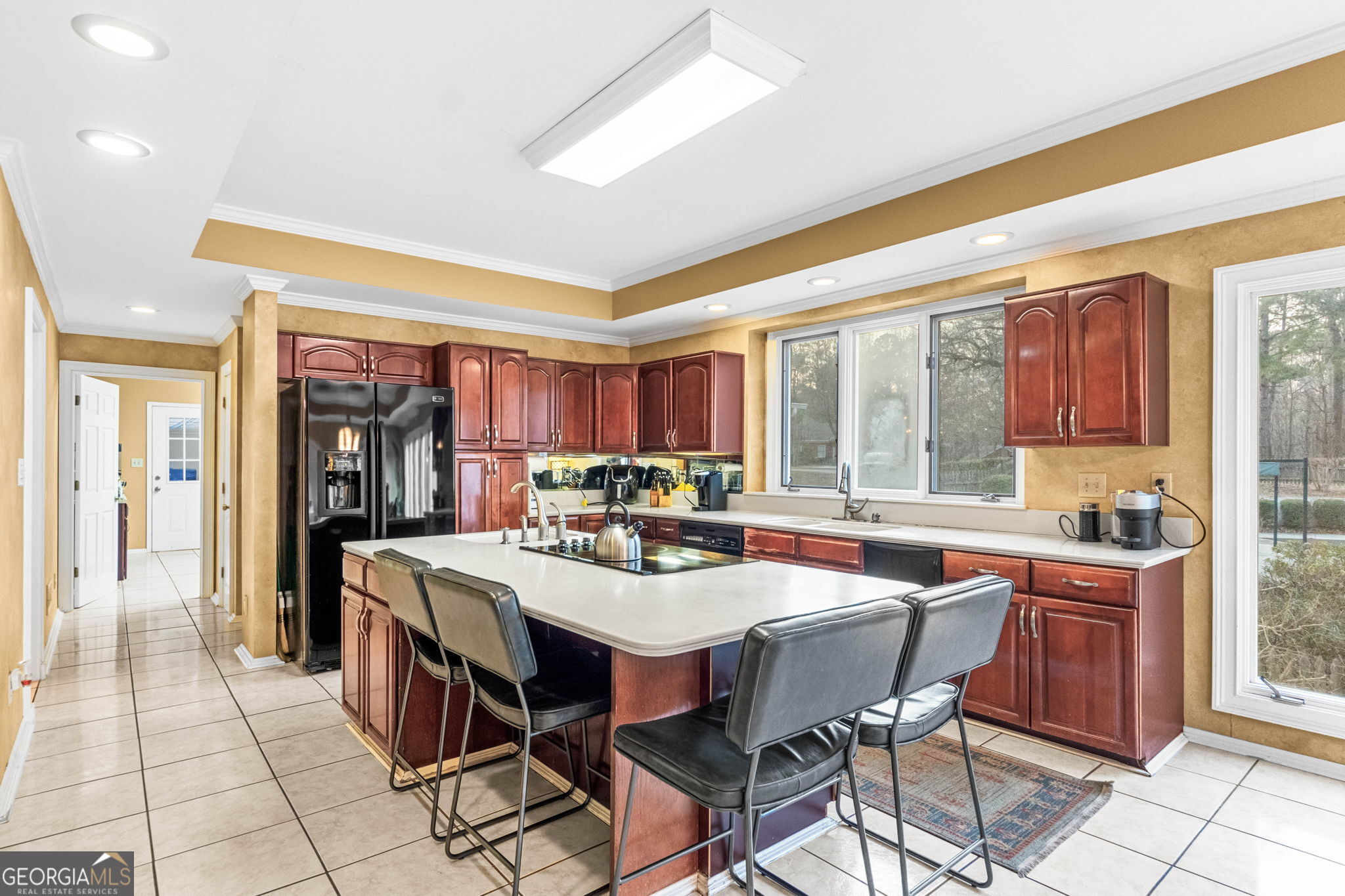 140 Thorne Ridge Trail Fayetteville, GA 30214 - Photo 13 of 44 a dining hall with stainless steel appliances granite countertop a stove a sink a dining table and chairs