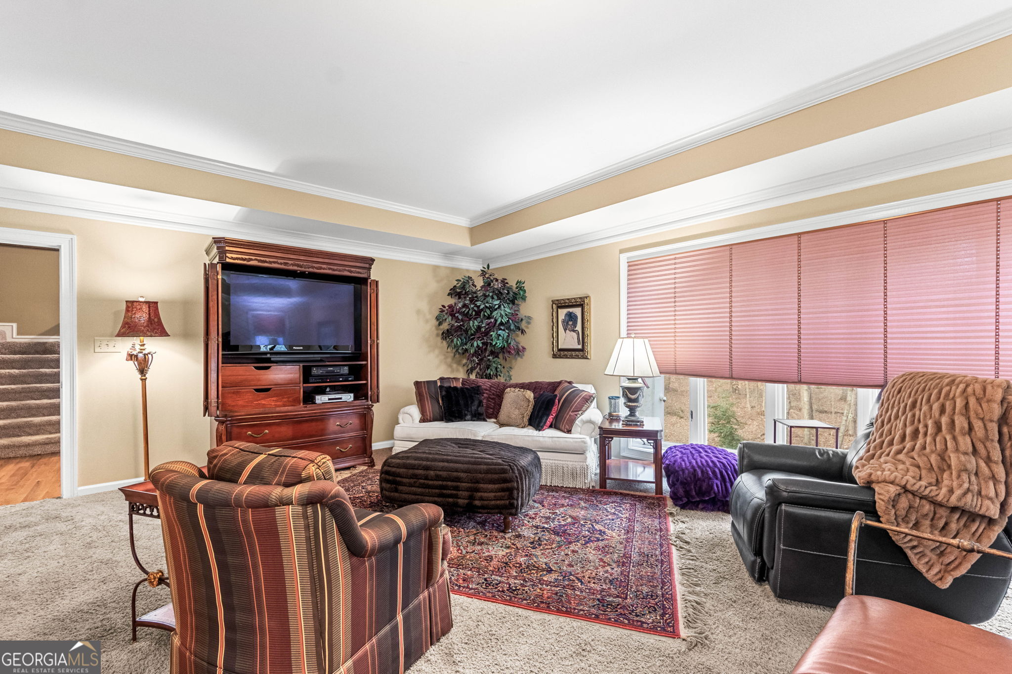 140 Thorne Ridge Trail Fayetteville, GA 30214 - Photo 21 of 44 a living room with furniture a flat screen tv and a window