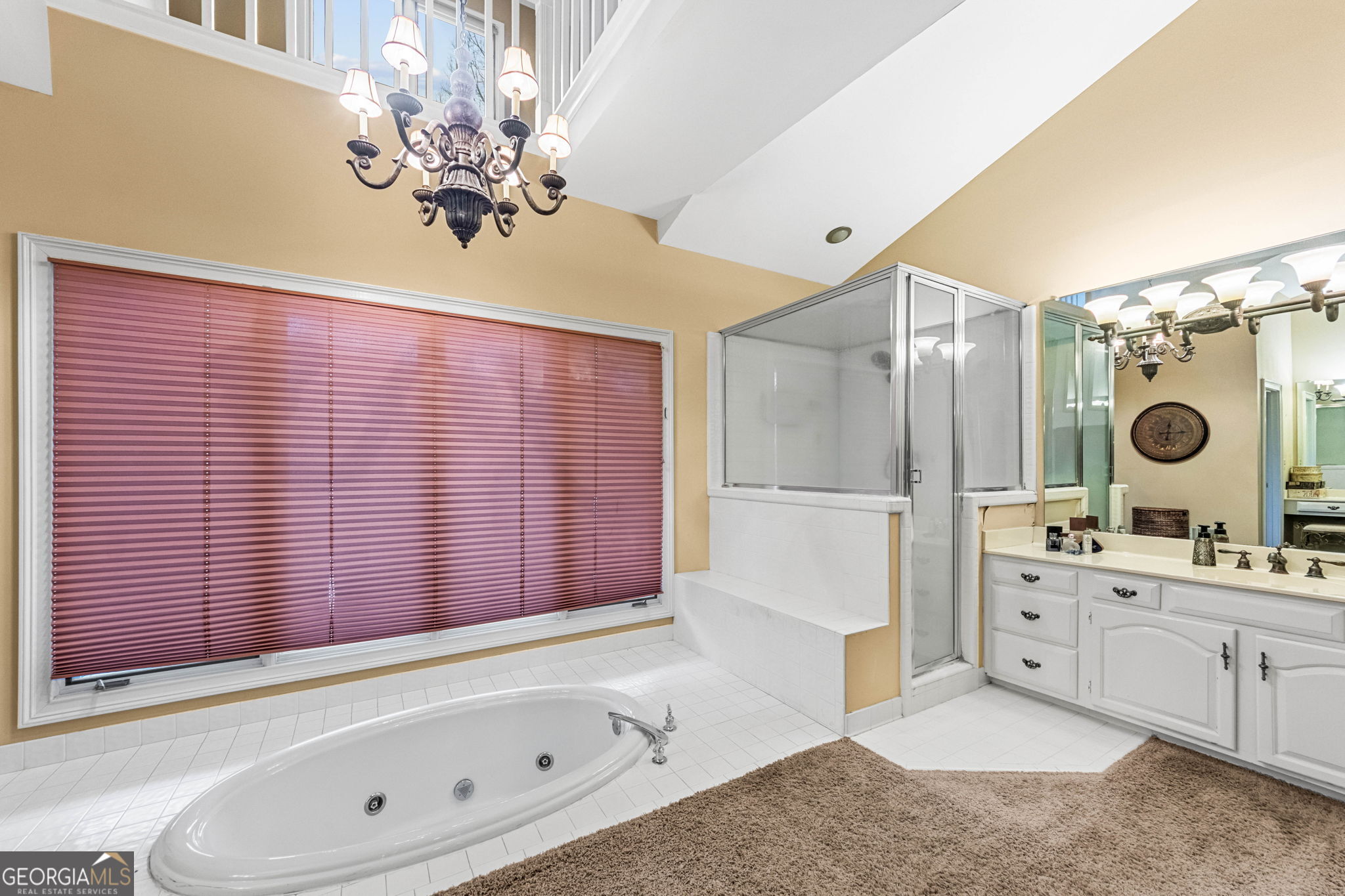 140 Thorne Ridge Trail Fayetteville, GA 30214 - Photo 22 of 44 a spacious bathroom with a double vanity sink a mirror and a bathtub