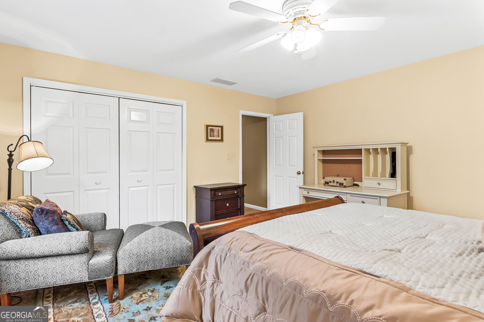 140 Thorne Ridge Trail Fayetteville, GA 30214 - Photo 30 of 44 a spacious bedroom with a bed and a couch