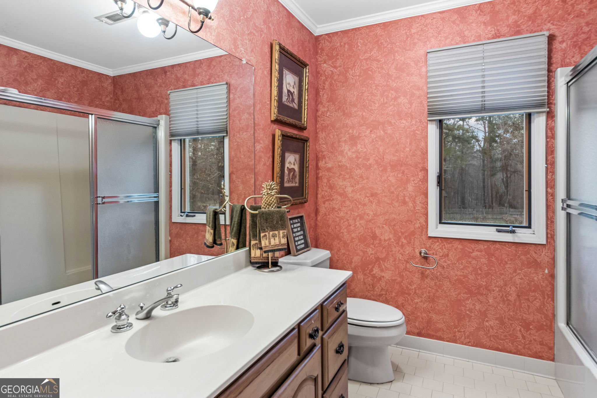 140 Thorne Ridge Trail Fayetteville, GA 30214 - Photo 31 of 44 a bathroom with a sink a toilet a mirror and shower