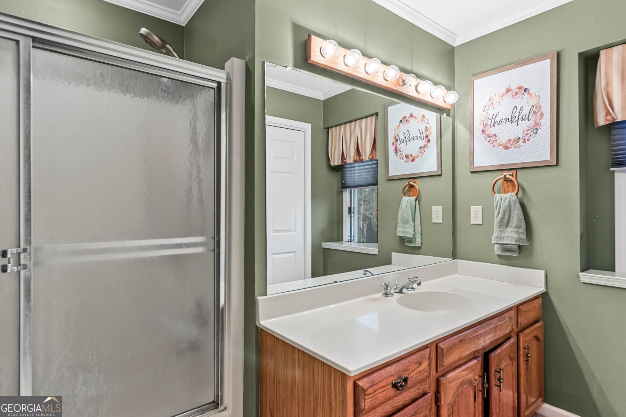 140 Thorne Ridge Trail Fayetteville, GA 30214 - Photo 33 of 44 a bathroom with a sink and a mirror