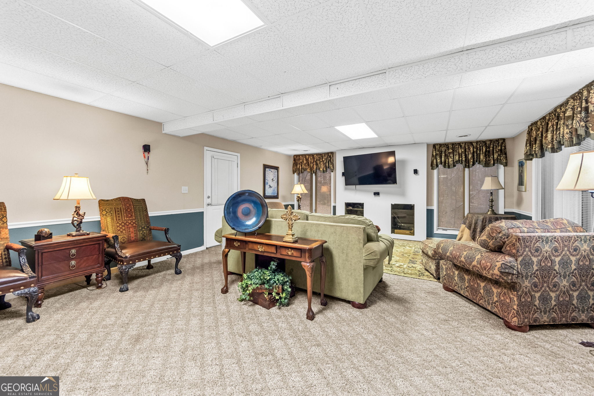 140 Thorne Ridge Trail Fayetteville, GA 30214 - Photo 34 of 44 a living room with furniture a fireplace and a flat screen tv