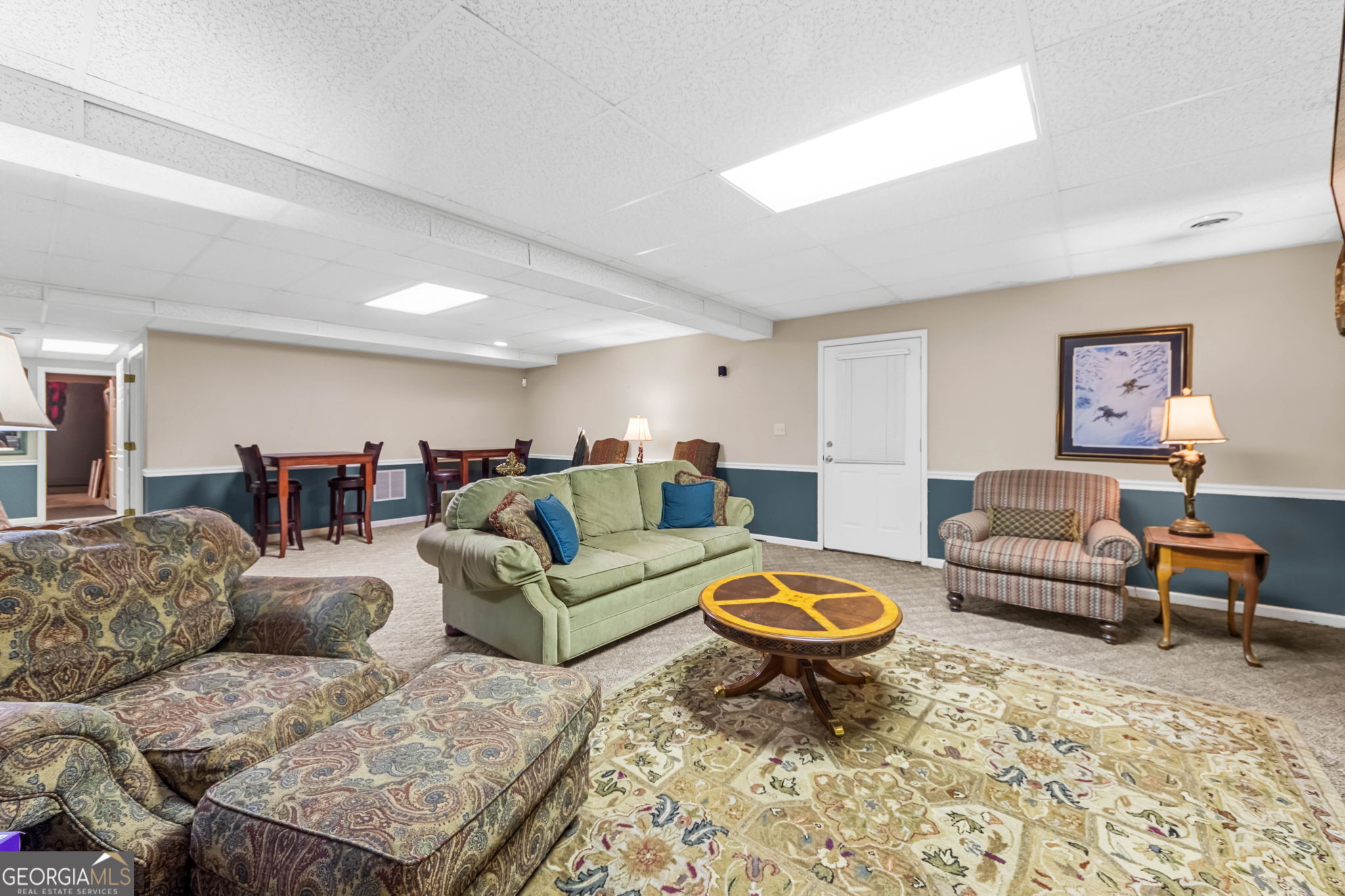 140 Thorne Ridge Trail Fayetteville, GA 30214 - Photo 35 of 44 a living room with furniture a rug and a couch