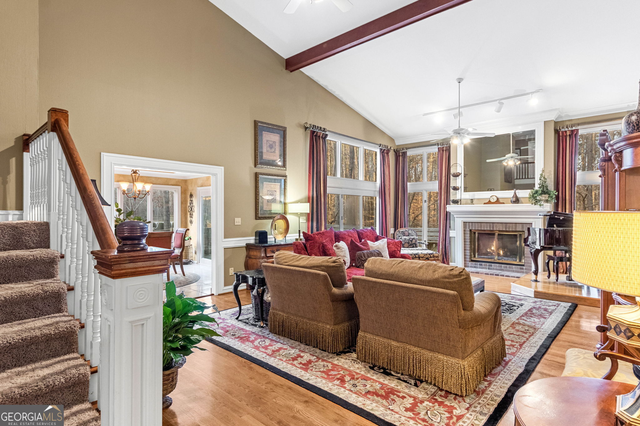 140 Thorne Ridge Trail Fayetteville, GA 30214 - Photo 6 of 44 a living room with furniture a flat screen tv and a fireplace