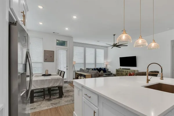 a kitchen with a sink cabinets and window