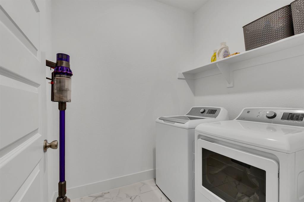 1817 Lockhart Drive Forney, TX 75126 - Photo 30 of 32 a utility room with dryer and washer