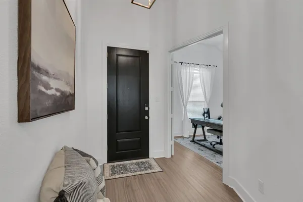 a room with furniture and wooden floor