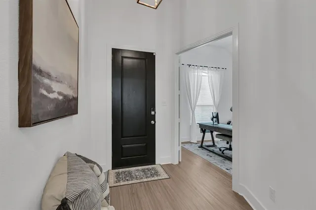 a room with furniture and wooden floor