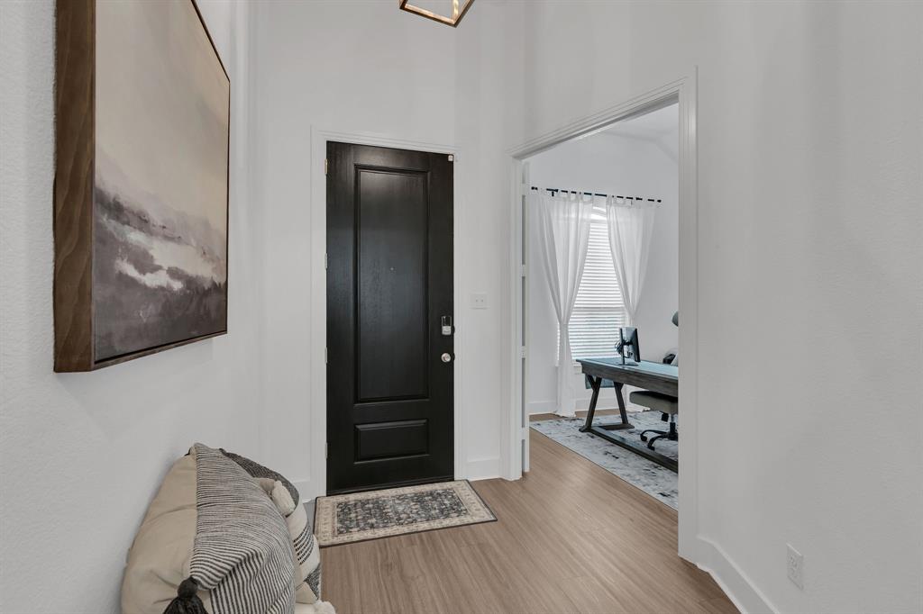 1817 Lockhart Drive Forney, TX 75126 - Photo 5 of 32 a room with furniture and wooden floor