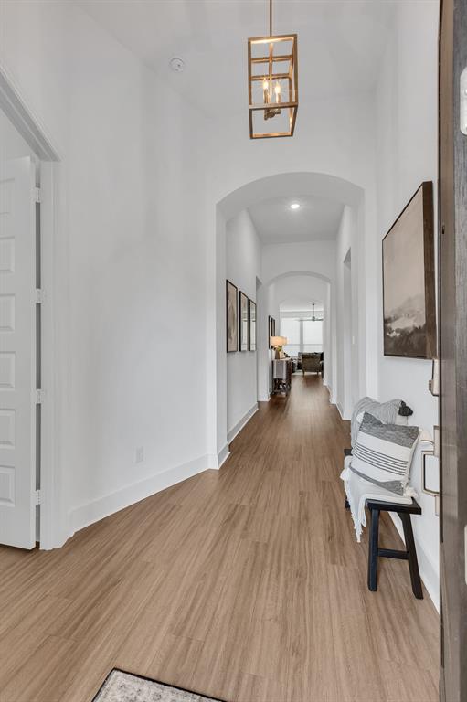 1817 Lockhart Drive Forney, TX 75126 - Photo 6 of 32 a living room with furniture and a wooden floor