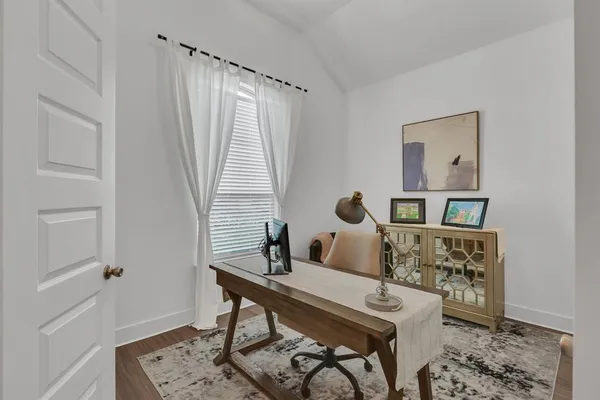 a bedroom with a bed and a table in it