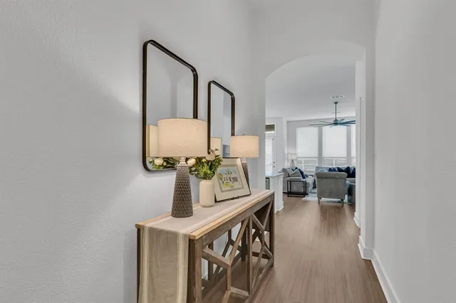 a view of living room with furniture and wooden floor