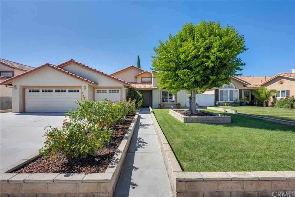 9265 Middlefield Drive Riverside, CA 92508 - Photo 1 of 1 a front view of a house with a garden