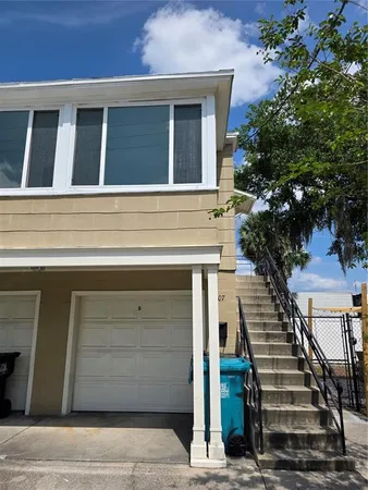 a front view of a house with stairs