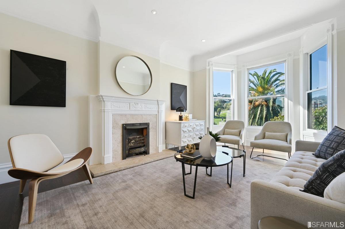 553 Dolores Street San Francisco, CA 94110 - Photo 1 of 28 a living room with furniture a fireplace and a flat screen tv
