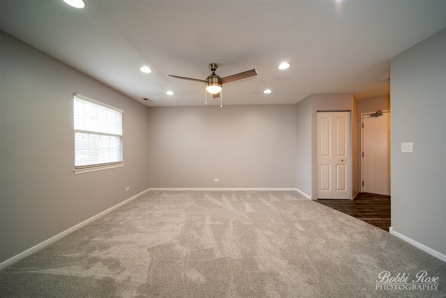 106 Gant Circle, Unit G Streamwood, IL 60107 - Photo 8 of 12 en view of an empty room with a window