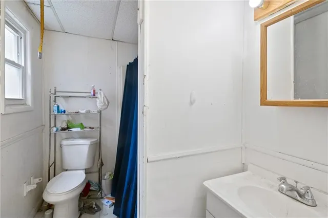 a view of a house with a door and wooden walls