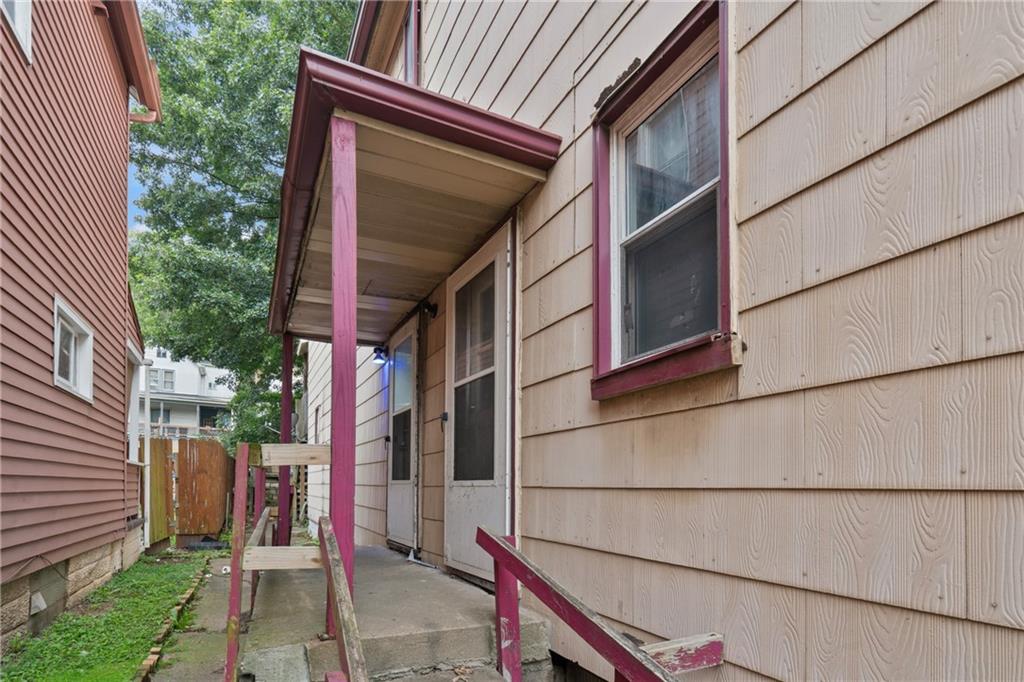 525 Larimer Avenue Turtle Creek, PA 15145 - Photo 14 of 28 a view of a house with a door and wooden walls