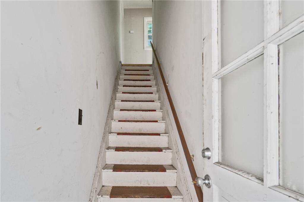 525 Larimer Avenue Turtle Creek, PA 15145 - Photo 15 of 28 a view of staircase with wooden floor and white walls