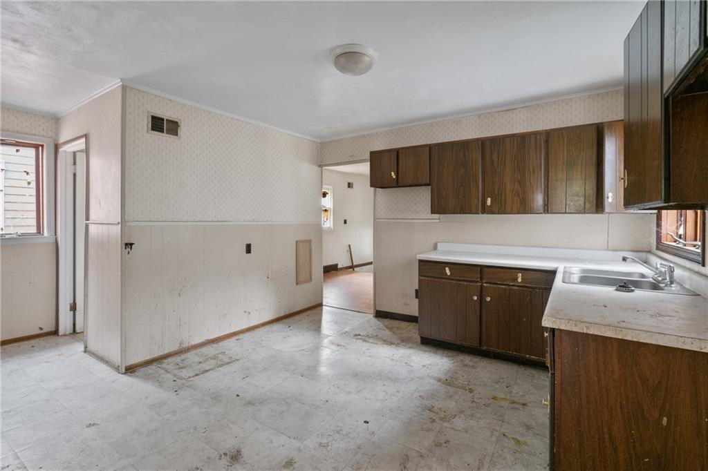 525 Larimer Avenue Turtle Creek, PA 15145 - Photo 18 of 28 a kitchen with a sink stove and refrigerator