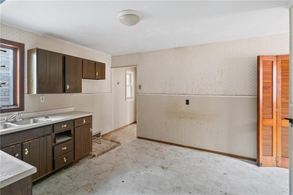 525 Larimer Avenue Turtle Creek, PA 15145 - Photo 19 of 28 a bathroom with a sink and a mirror
